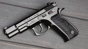 A CZ 75 B pistol lying on a timber surface