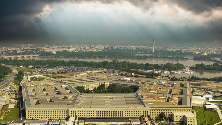 An aerial view of the Pentagon with Washington DC beyond