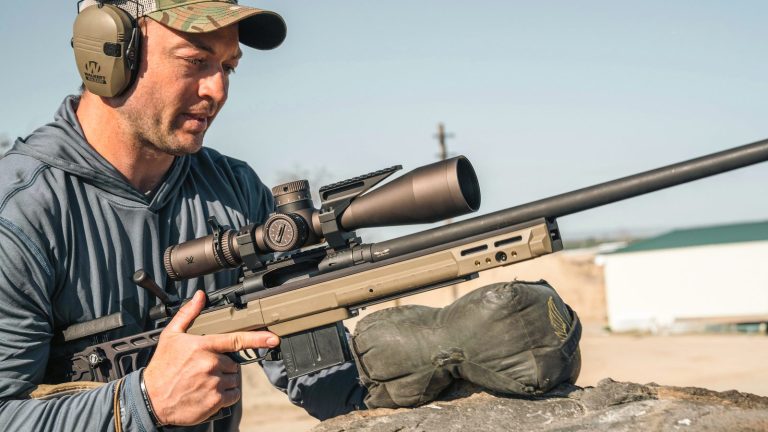 A competitor behind a precision rifle fitted with a Vortex Razor HD Gen III riflescope