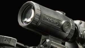 A Holosun optic mounted on a rifle, against a black background