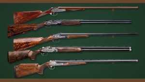 Five of the best shotguns in the guide, from Purdey, Holland & Holland, Rigby, Beretta and Fabarm, on a gun-room rack
